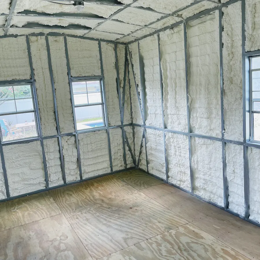 Closed-cell spray foam insulation applied to wall cavities in a residential project in Munford